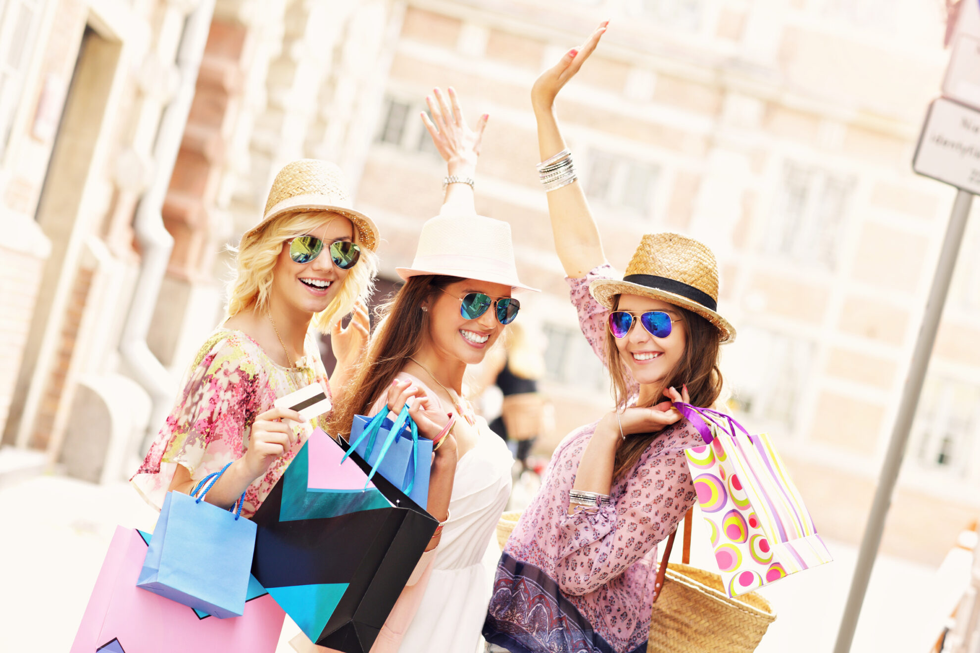 A picture of a group of happy friends shopping in the city